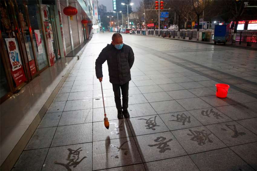 A man in Jiujiang, China, wears a face mask Feb. 3, 2020, as the country is hit by the coronavirus. The Vatican press office confirmed a report that appeared in the Chinese newspaper The Global Times, which said that since Jan. 27, the Vatican has sent 600,000-700,000 protective masks to China.