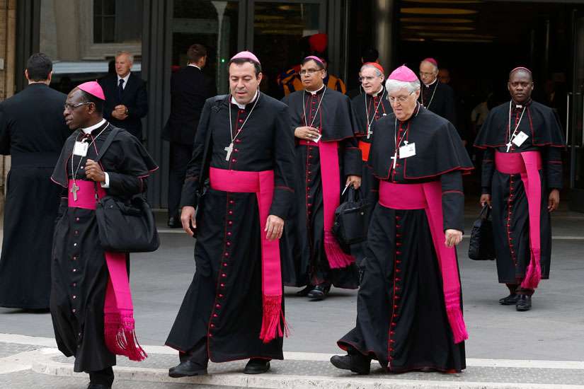 Bishops leave a session of the Synod of Bishops on the family at the Vatican Oct. 9.