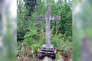 A cross marks a grave at an internment camp for those of “enemy nationality” at Spirit Lake in Quebec.