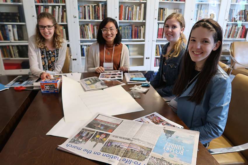 Kate Jamieson, right, participates in a photography workshop with fellow Youth Speak News writers Jacklyn Gilmor, Marie Gamboa and Mirjana Villaneuve at the YSN 2018 retreat. 