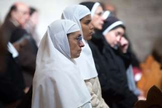  Nuns pray during Mass Jan. 6 in the Church of St. Catherine, adjacent to the Church of the Nativity, in Bethlehem, West Bank. The Mass was held by Catholics in the church as Orthodox Christians celebrated Christmas eve in the Church of the Nativity.