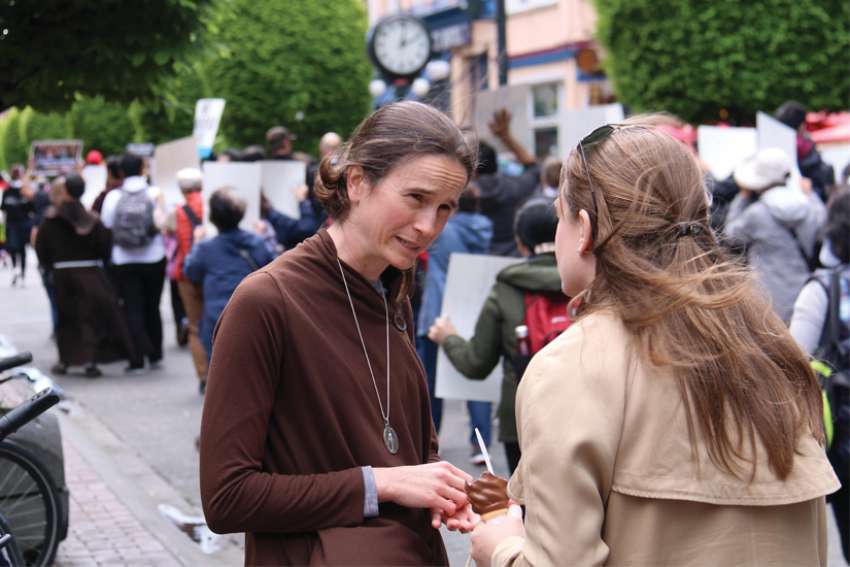 Mary Wagner talks to a woman attending the March for Life rally in Ottawa in 2018.