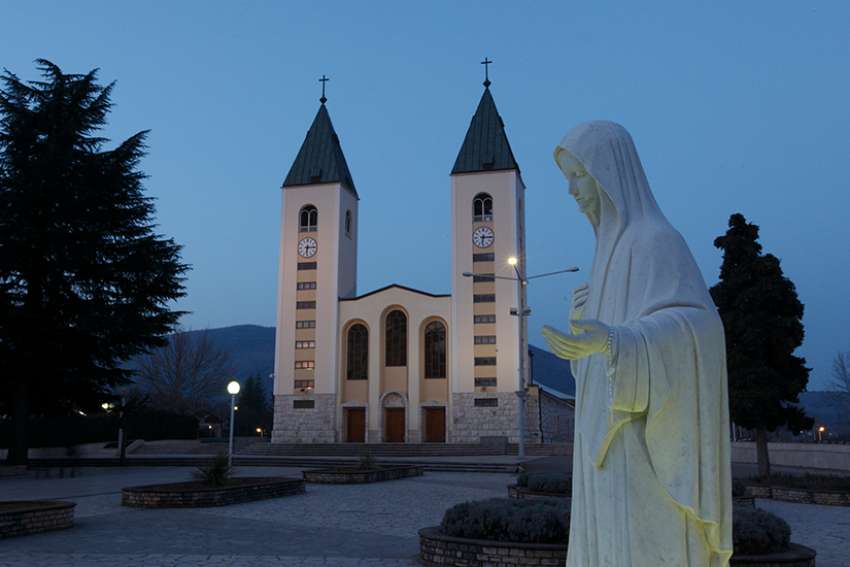 A statue of Mary is seen outside St. James Church in Medjugorje, Bosnia-Herzegovina, in this Feb. 27, 2011, file photo. Pope Francis has decided to allow parishes and dioceses to organize official pilgrimages to Medjugorje; no decision has been made on the authenticity of the apparitions. 