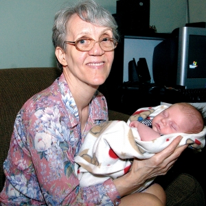 Pro-life activist Linda Gibbons cradles newborn grandson, Marshall. Gibbons visited him and granddaughter, Kayla, soon after being released from prison on June 3 after a 28-month stay.