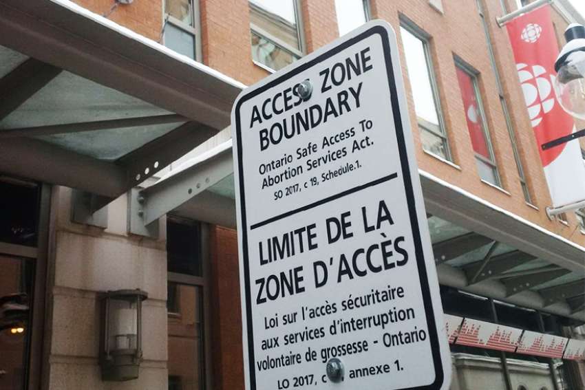 Bubble zone street signs cite Bill 163 outside abortion clinics in Ottawa. 
