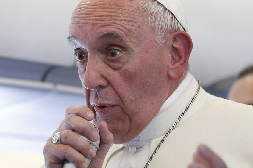 Pope Francis speaks with journalists aboard his flight from Portugal to Rome May 13. The Pope made a two-day visit to Fatima to commemorate the 100th anniversary of the Marian apparitions and to canonize Sts. Francisco and Jacinta Marto, two of the young seers.