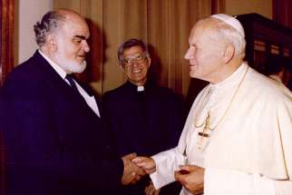 Romeo Maoine meets Pope John Paul II. Mr. Maoine was the first director of Development and Peace. He died May 12.