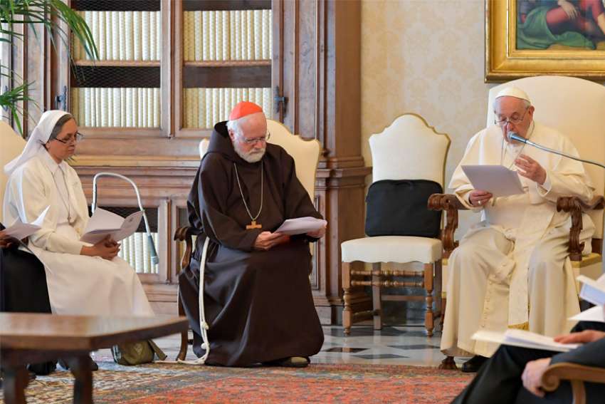 Pope Francis speaks during a meeting with members of the Pontifical Commission for the Protection of Minors at the Vatican April 29, 2022. Also pictured is Sister Arina Gonslaves, vice-provincial of the Religious of Jesus and Mary, and Boston Cardinal Seán P. O&#039;Malley, commission president.