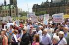 Opponents of euthanasia and assisted suicide rally on Parliament Hill in Ottawa, Ontario, in early June 2016. Medical ethicist Fr. Mark Miller recommends adding a line about rejecting the suicide option, just in case.