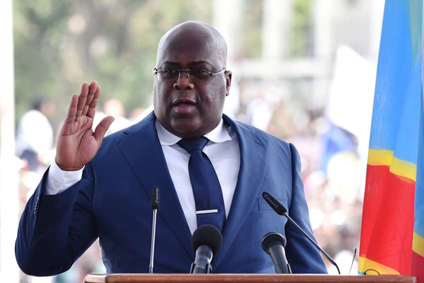 Congolese President Felix Tshisekedi raises his hand as he is sworn into office during his inauguration ceremony in Kinshasa Jan. 24, 2019. 