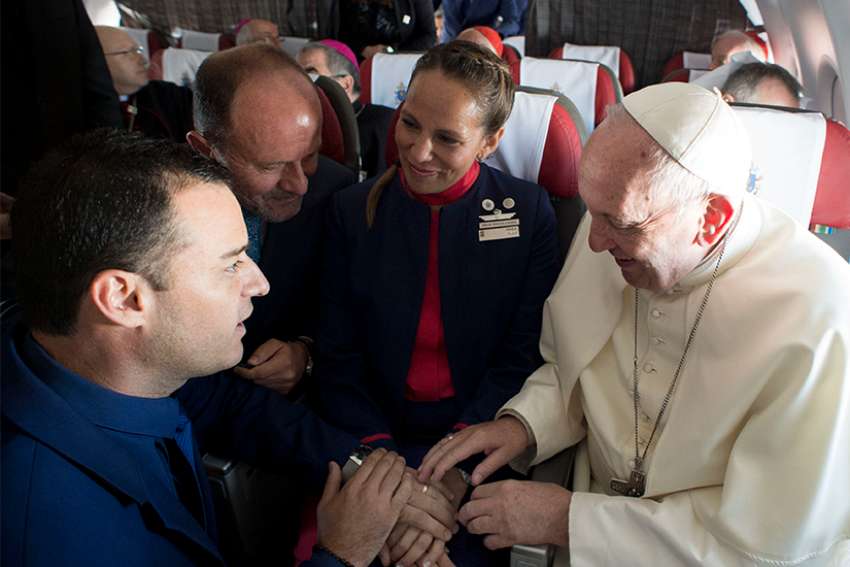 Pope Francis performs an impromptu wedding ceremony for Latam Airlines employees Carlos Ciuffardi Elorriaga, 41, and Paula Podest Ruiz, 39, aboard the pontiff&#039;s flight from Santiago, Chile, to Iquique Jan. 18.