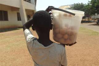 A boy sells eggs on the streets of Bangui, Central African Republic, in April 2021.