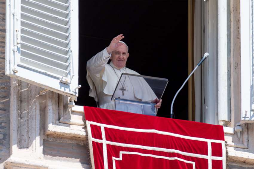 Pope Francis waves as he leads the &quot;Regina Coeli&quot; from the window of his studio overlooking St. Peter&#039;s Square at the Vatican April 25, 2021. The pope prayed for the victims of a fire at a Baghdad hospital and also for migrants who drowned in a shipwreck off the coast of Libya.