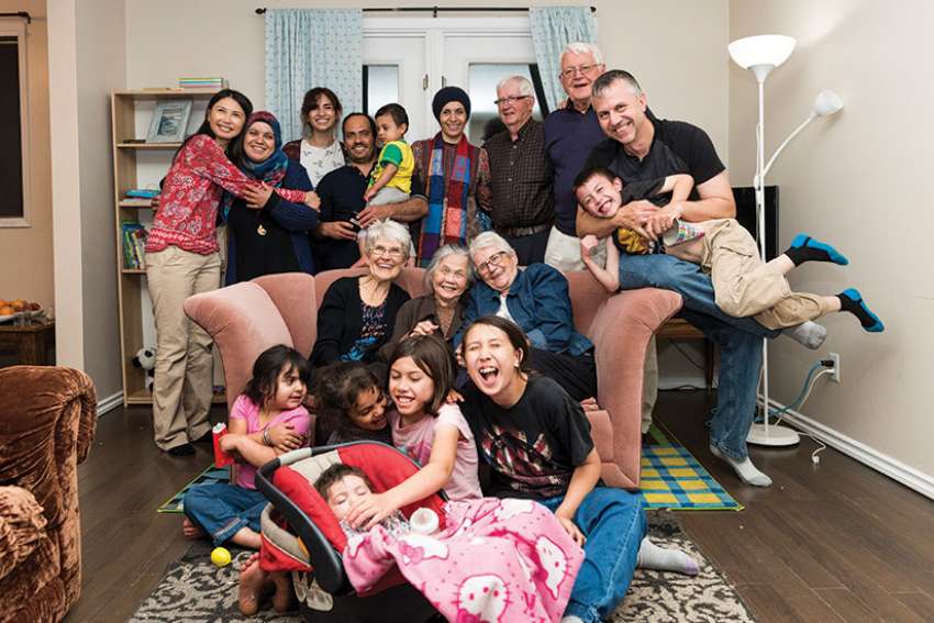 Dr. Nhung Tran-Davies (top left) and her family were sponsored by Our Lady of Mercy Parish in Enoch, Alta., when they escaped Vietnam in 1979. She has paid forward their favour some 40 years later by sponsoring the Alshablis, a Syrian refugee family. Her story of generosity will be highlighted in a film to be released by the UN this fall.