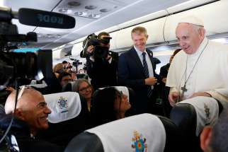 Pope Francis greets Associated Press cameraman Paolo Lucariello