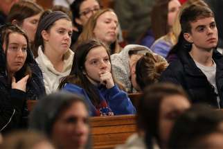 Young people listen to the homily during the closing Mass of the National Prayer Vigil for Life Jan. 18 at the Basilica of the National Shrine of the Immaculate Conception in Washington. 