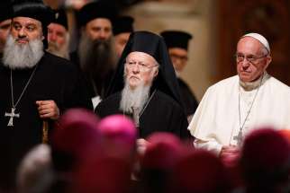 Ecumenical Patriarch Bartholomew of Constantinople and Pope Francis attend an ecumenical prayer service with other religious leaders in the Basilica of St. Francis in Assisi, Italy, Sept. 20.