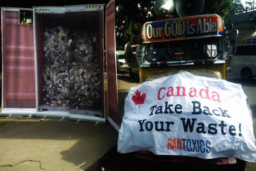 Environmental activist group Ban Toxics displays an image of a container of trash from Canada a few kilometers from where Prime Minister Justin Trudeau is attending the ASEAN summit on Nov. 14. 