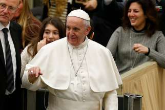 Pope Francis arrives to lead his general audience in Paul VI hall at the Vatican Feb. 1.