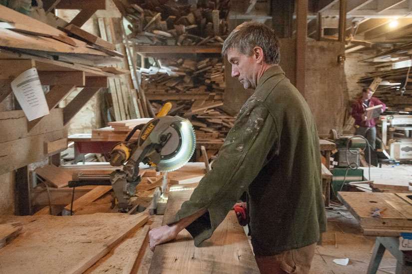  Woodworker Michael Schmiedicke works in his Strong Oaks Woodshop April 29 in Front Royal, Va. Schmiedicke, a parishioner of St. John the Baptist Church in Front Royal, builds caskets out of reclaimed lumber from the Shenandoah Valley.