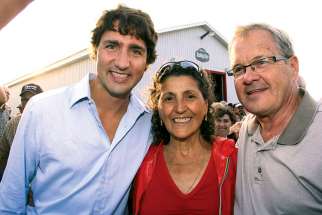 MP Laurence MacAulay, right, with Liberal leader Justin Trudeau and a constituent.