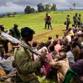 Congolese soldiers guard suspected M23 rebel fighters who surrendered near Goma, Congo, Nov. 5. The Catholic Church rejoiced at the end of a yearlong military campaign by the defeated rebels, but made it clear that much remains to be done to consolidate that peace.