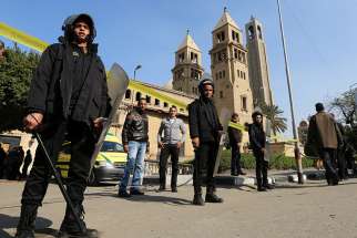 Members of the special police forces stand guard to secure the area around the Coptic Orthodox cathedral complex Dec. 11 after an explosion inside the complex in Cairo. St. Mark&#039;s Cathedral has since been restored.