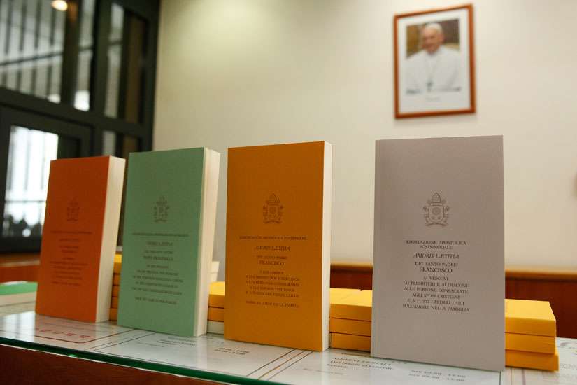 Copies of Pope Francis&#039; apostolic exhortation on the family, &quot;Amoris Laetitia&quot; (&quot;The Joy of Love&quot;), are seen during the document&#039;s release at the Vatican April 8. The exhortation is the concluding document of the 2014 and 2015 synods of bishops on the family.