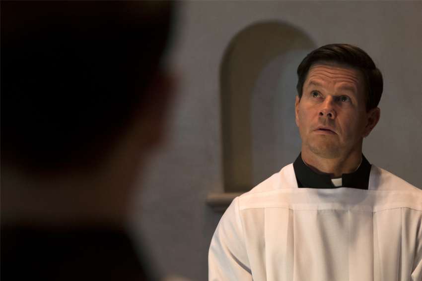 Mel Gibson, right, plays Bill Long, father to Mark Wahlberg’s Fr. Stu in the film Fr. Stu.