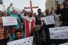 Members of the Christian community chant slogans as they hold placards during a protest in Karachi, Pakistan, Aug. 17, 2023, to condemn the attacks on churches and houses in the Jaranwala town of Faisalabad. A Muslim crowd vandalized churches and torched homes Aug. 16 after two Christians were accused of blasphemy.