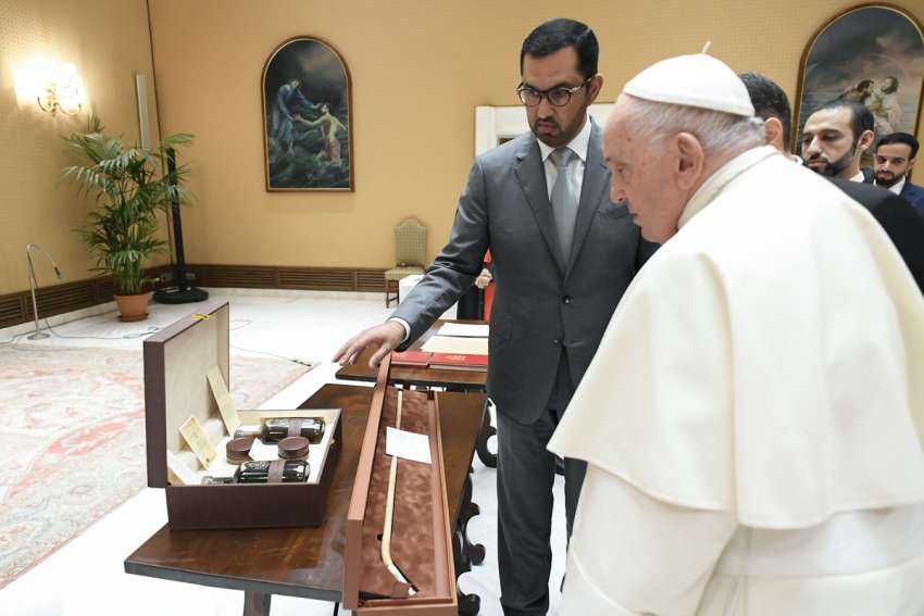 Pope Francis receives a gift from Sultan al-Jaber, the president-designate of the 2023 United Nations Climate Change Conference, known as COP28, during a meeting at the Vatican Oct. 11, 2023. COP28 is set to open Nov. 30 in Dubai and the pope will travel there Dec. 1-3.
