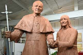Cast in clay is the model for artist Louise Weir’s monument to St. John Paul II and Mother Teresa.
