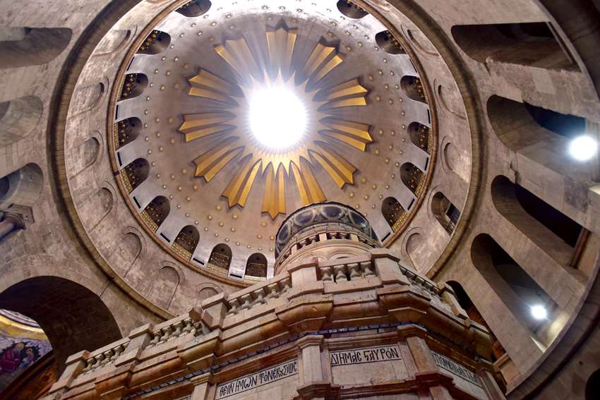 Beams of light shine through the dome of the Church of the Holy Sepulcher in the Old City of Jerusalem.