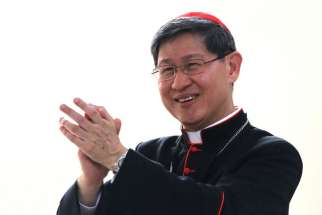 Philippine Cardinal Luis Tagle of Manila claps while speaking to World Youth Day pilgrims July 27 at St. Joseph Church in Krakow, Poland. 