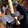 Voters in Boston look over information on ballot questions while waiting at a polling place Nov. 6. Massachusetts voters voters narrowly defeated a &quot;death with dignity&quot; measure, rejecting attempts to legalize assisted suicide. 