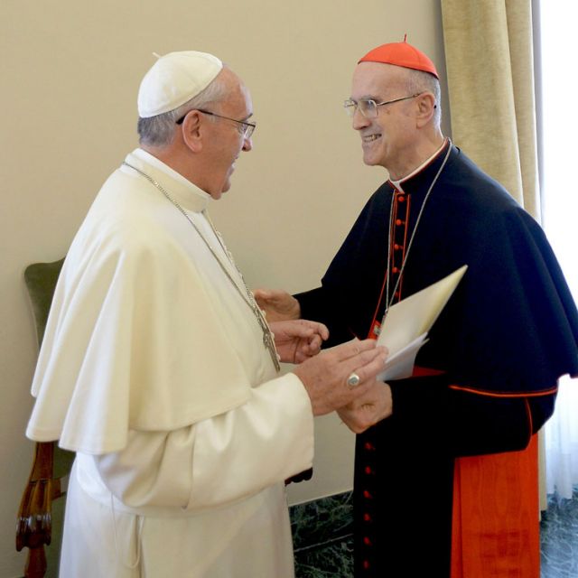 Pope Francis talks with the outgoing Vatican secretary of state, Cardinal Tarcisio Bertone, during the cardinal&#039;s farewell ceremony at the Vatican Oct. 15. Pope Francis acknowledged his contribution to the running of the Vatican.