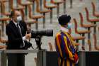 A Swiss Guard is seen as Vatican photographer Simone Risoluti works during Pope Francis&#039; general audience in Paul VI hall at the Vatican Oct. 7, 2020. The weekend of Oct. 10-11, four Swiss Guards were found to have COVID-19 and are symptomatic, the Vatican confirmed Oct. 12. 