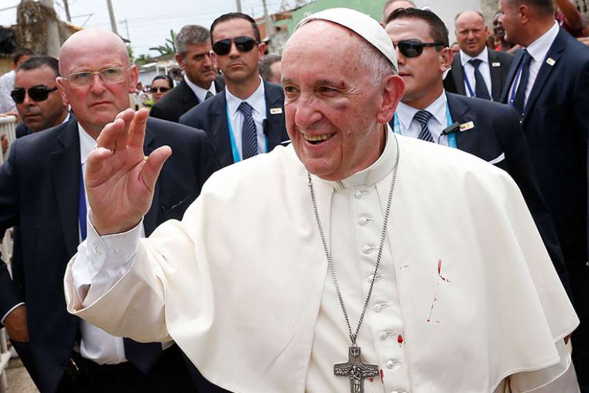 Pope Francis greets people as he arrives to bless a house in Cartagena, Colombia, Sept. 10. 