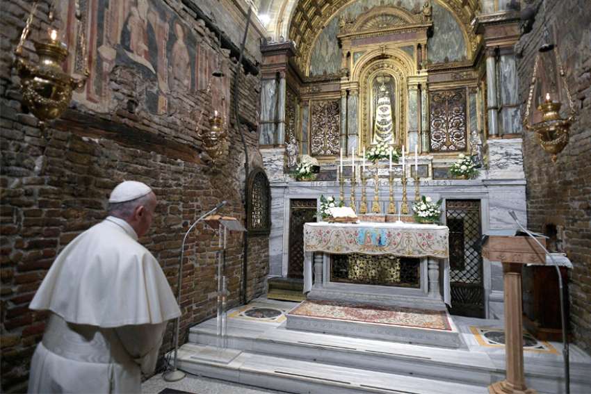 Pope Francis prays before a statue of Our Lady of Loreto at the Sanctuary of the Holy House on the feast of the Annunciation in Loreto, Italy, March 25, 2019. Pope Francis began the Jubilee Year of Our Lady of Loreto Dec. 8, 2019, and has extended the celebration to December 2021.