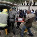 A victim of a bomb blast at U.N. offices in the Nigerian capital of Abuja is loaded into an ambulance, Aug. 26 after a car rammed into the building. Bishop Oliver Dashe Doeme of Maiduguri recently said the government should empower youths to help prevent the myriad of problems that lead to such violence. 