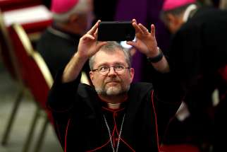  Montreal auxiliary Bishop Thomas Dowd takes a selfie before Pope Francis&#039; audience with young people and members of the Synod of Bishops at the Vatican Oct. 6.
