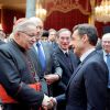 French President Nicolas Sarkozy greets Paris Cardinal Andre Vingt-Trois, next to Franc&#039;s Chief Rabbi Gilles Bernheim, left, at the Elysee Palace after he delivered his New Year wishes to the religious world. 