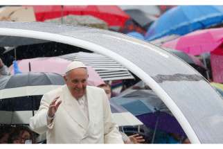 Rain falls as Pope Francis arrives to lead his general audience in St. Peter&#039;s Square at the Vatican March 25.
