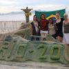 From left to right, Janelle de Rocquigny, Erynne Gilpin, Katrina Laquian, Shelley Burgoyne and Mélodie Grenier. After their meeting with the lead negotiator for the Canadian government delegation, members of the Development and Peace group stopped by a Rio+20 sandcastle at Copacabana beach in Rio de Janeiro.