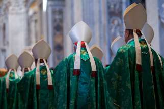Bishops arrive in procession for a Mass celebrated by Pope Francis to open the extraordinary Synod of Bishops on the family in St. Peter&#039;s Basilica at the Vatican Oct. 5. 