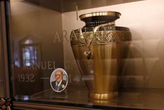 An urn containing cremated remains is seen in the Holy Sepulchre Cemetery mausoleum in Coram, N.Y. 2016.