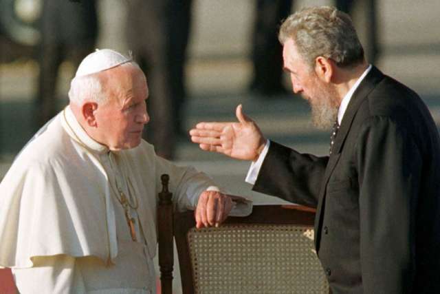 Cuban President Fidel Castro gestures to Pope John Paul II in Havana in 1998. It was the first visit to Cuba by a pope, and the Polish pontiff used it to appeal for greater religious rights. 