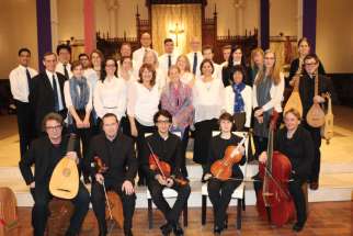 Musicians in Ordinary and the St. Michael’s College Schola Cantorum, led by Michael O’Connor, second row left, bring musical meditation to the crucifixion of Christ. 