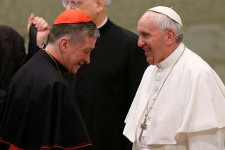 Cardinal Blase J. Cupich of Chicago walks away after meeting Pope Francis during his general audience in Paul VI hall at the Vatican Feb. 7.