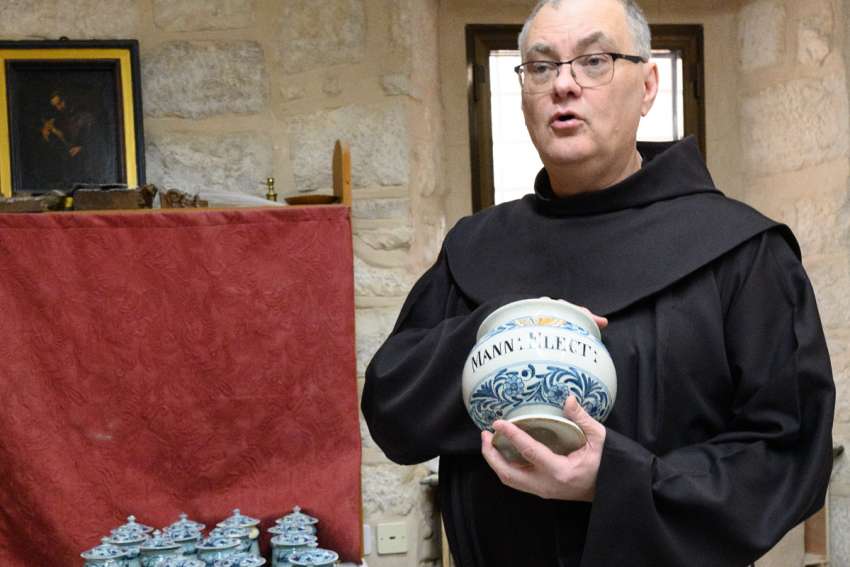 Franciscan Father Stéphane Milovitch, director of the Cultural Heritage Office for the Custodia Terrae Sanctae in Jerusalem,with some of its 450 earthenware pharmaceutical pots from the 17th and 18th centuries.